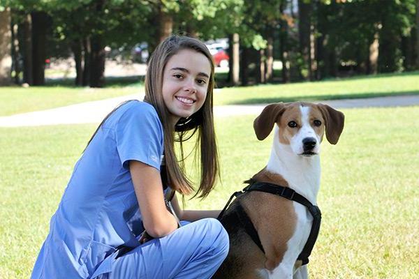 Vet med student with dog